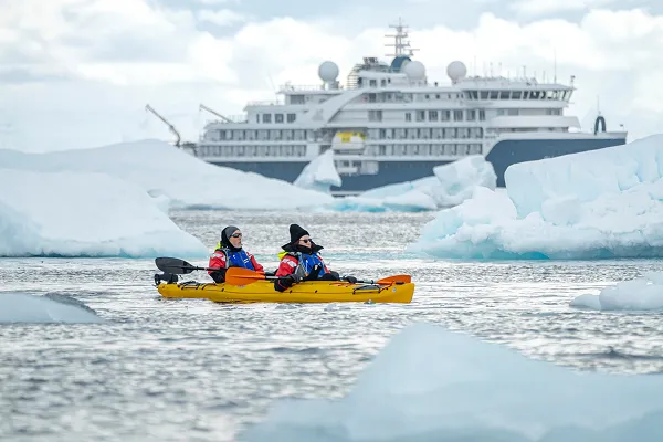 Sea kayaking among icebergs